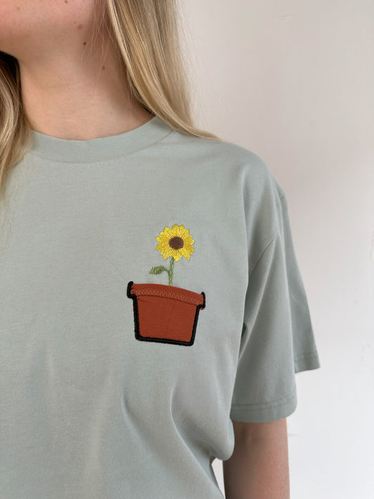 Sonnenblume im Brusttaschentopf