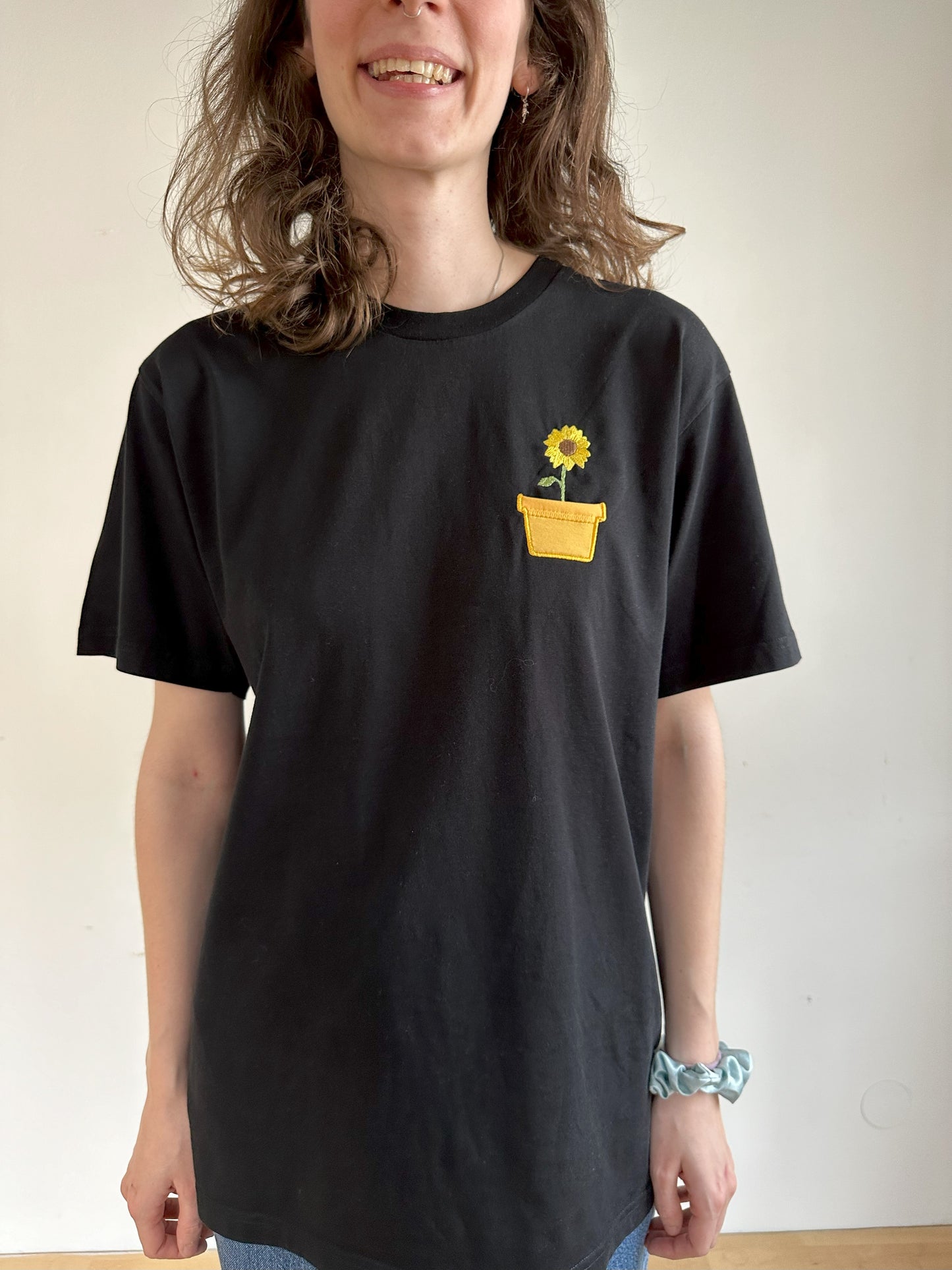 Sonnenblume im Brusttaschentopf