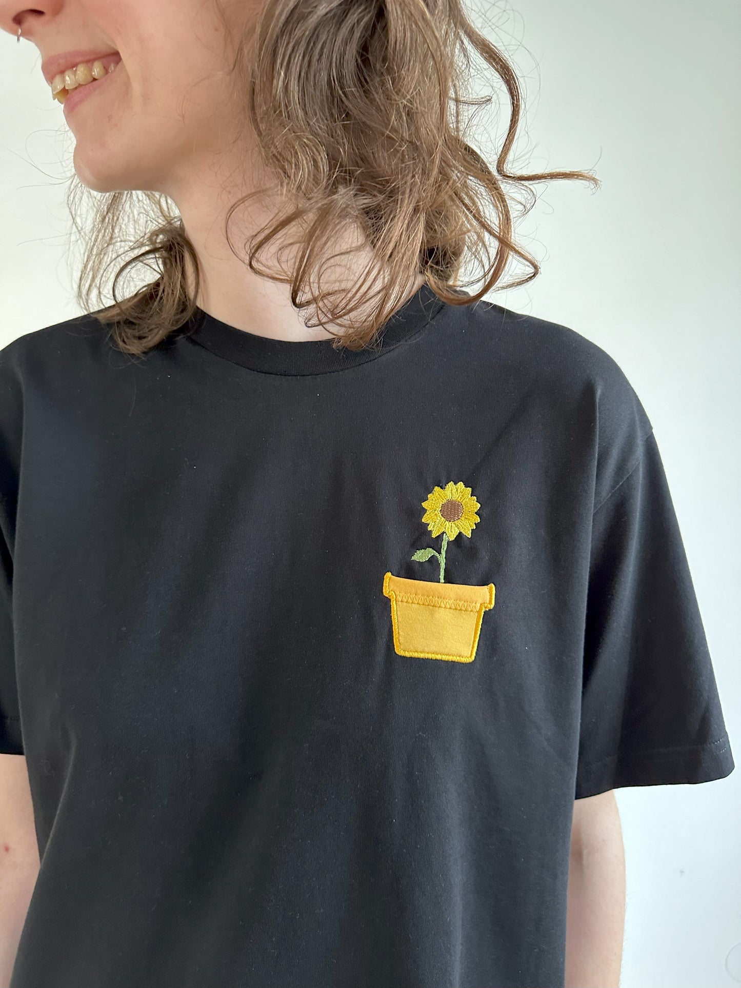 Sonnenblume im Brusttaschentopf