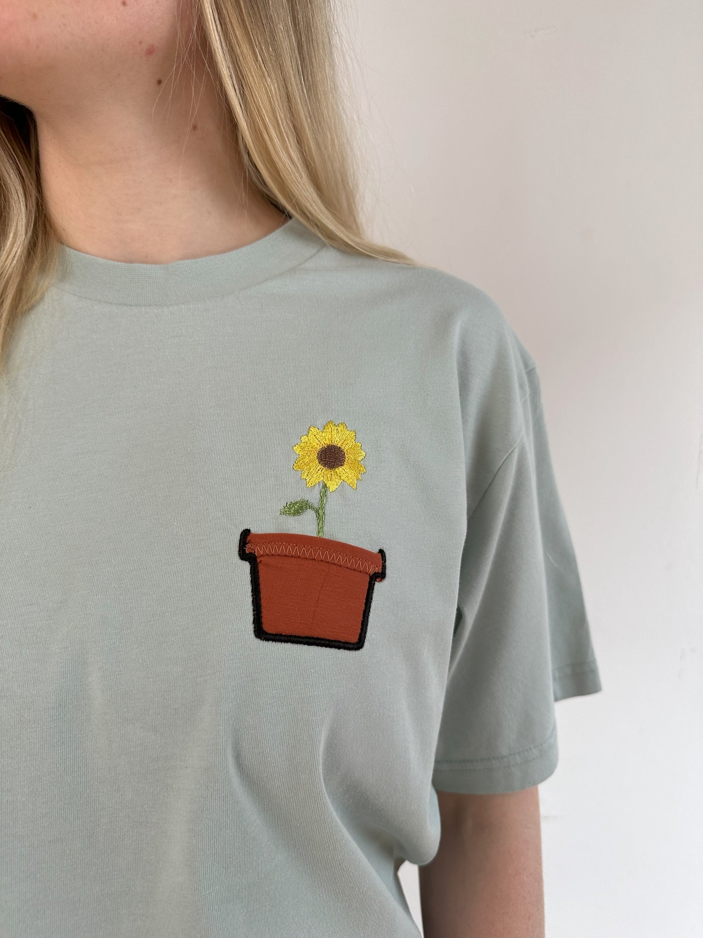 Sonnenblume im Brusttaschentopf