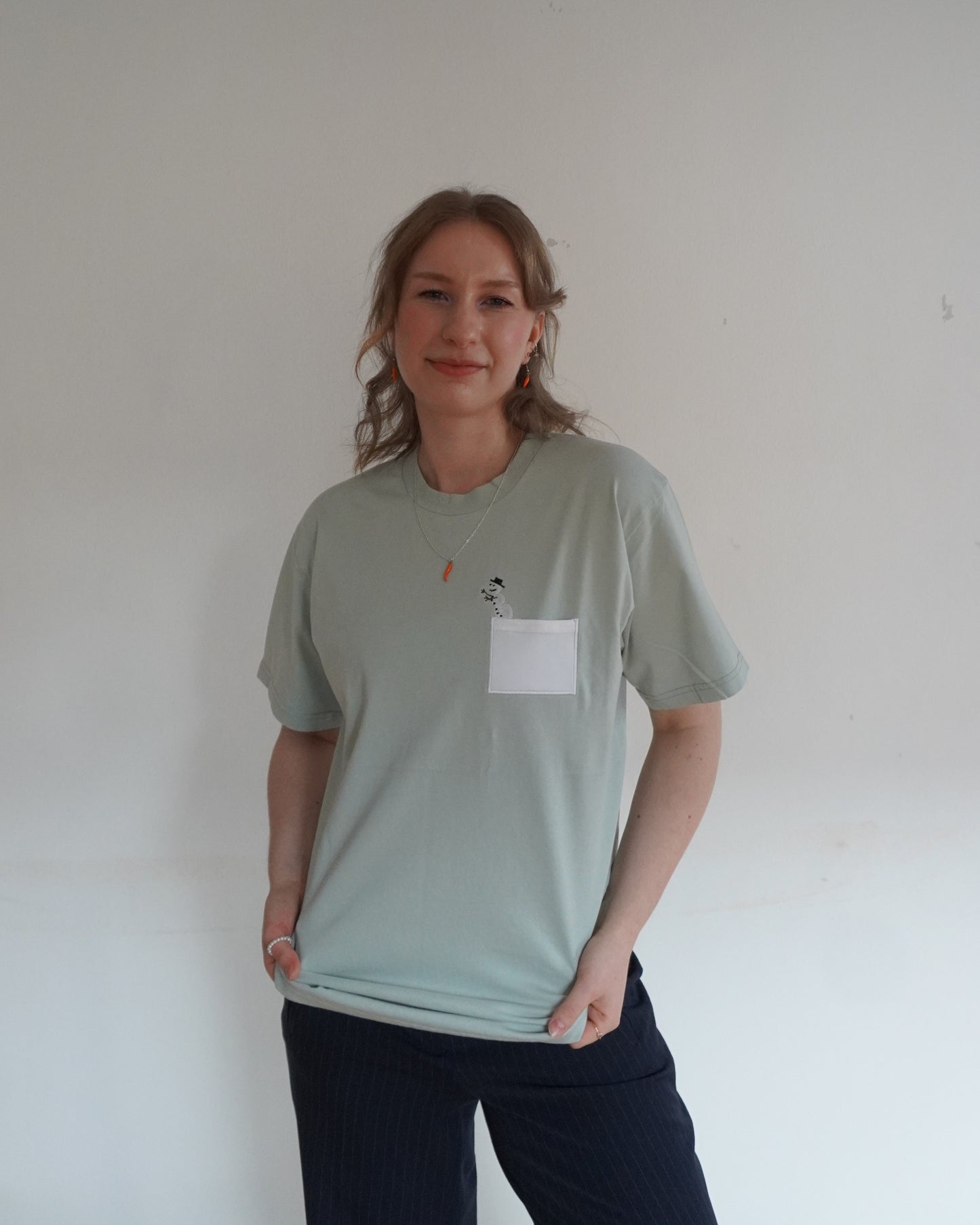 Schneemensch mit Brusttasche