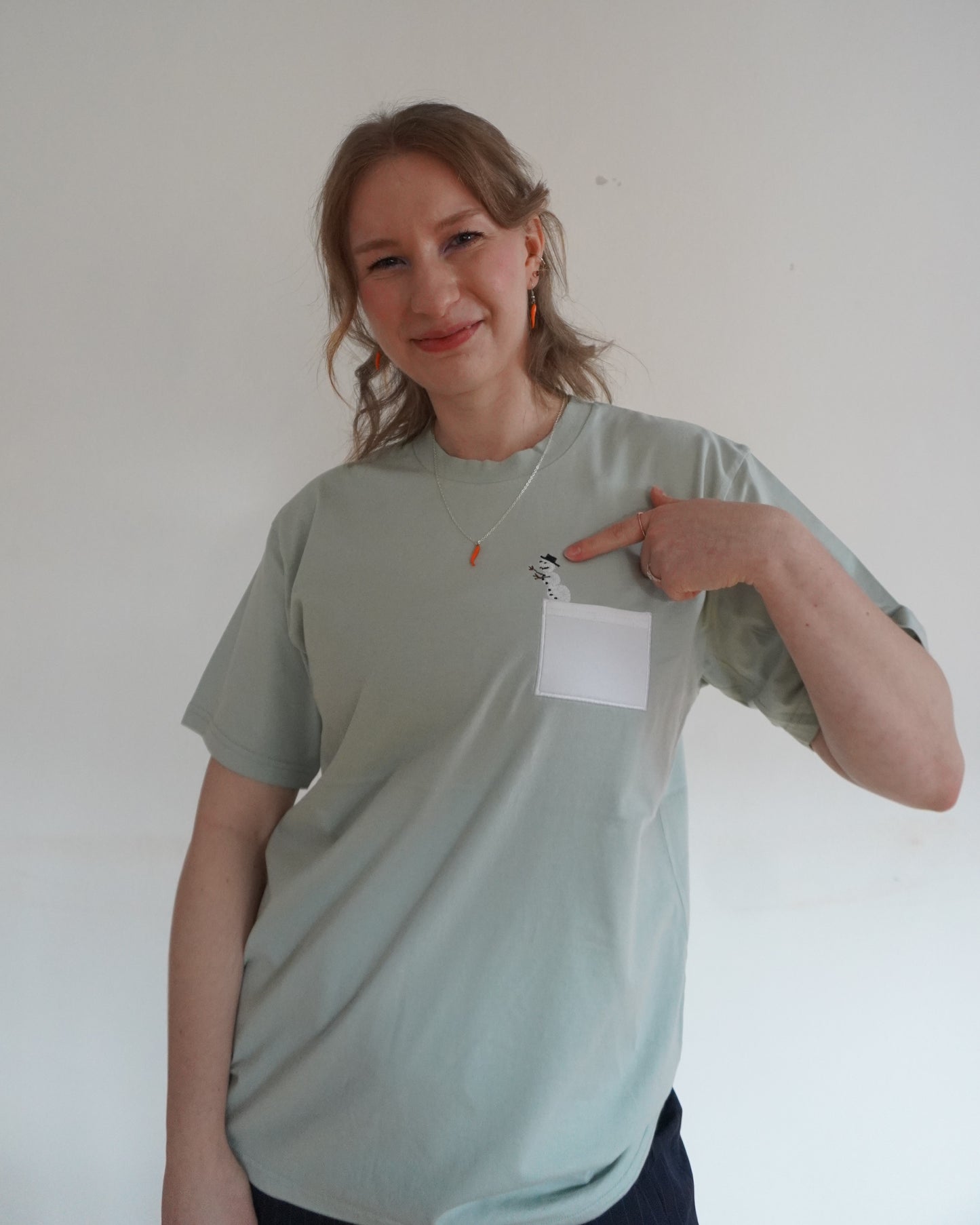 Schneemensch mit Brusttasche