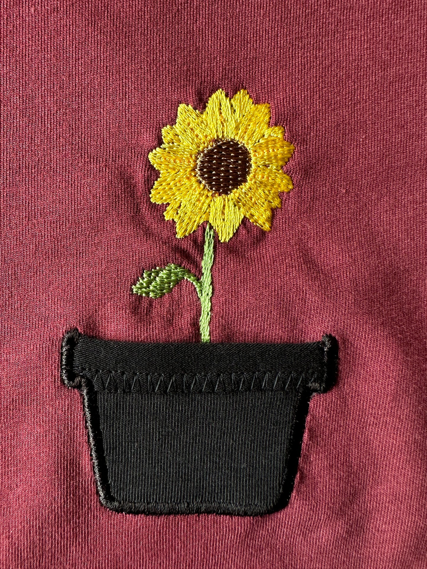 Sonnenblume im Brusttaschentopf