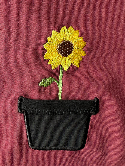 Sonnenblume im Brusttaschentopf